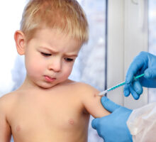toddler receiving shot of COVID vaccines for little children