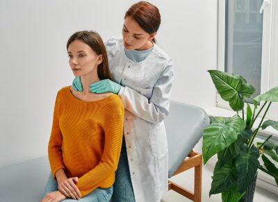 Doctor and patient discuss diagnosis and treatment of hypothyroidism or thyroid cancer