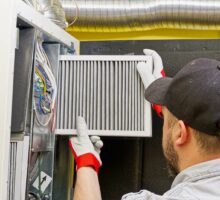 Technician inserts HEPA filter for better indoor air quality